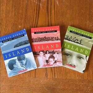 Scholastic Island Series by Gordon Korman - Blue, Red, Green Covers